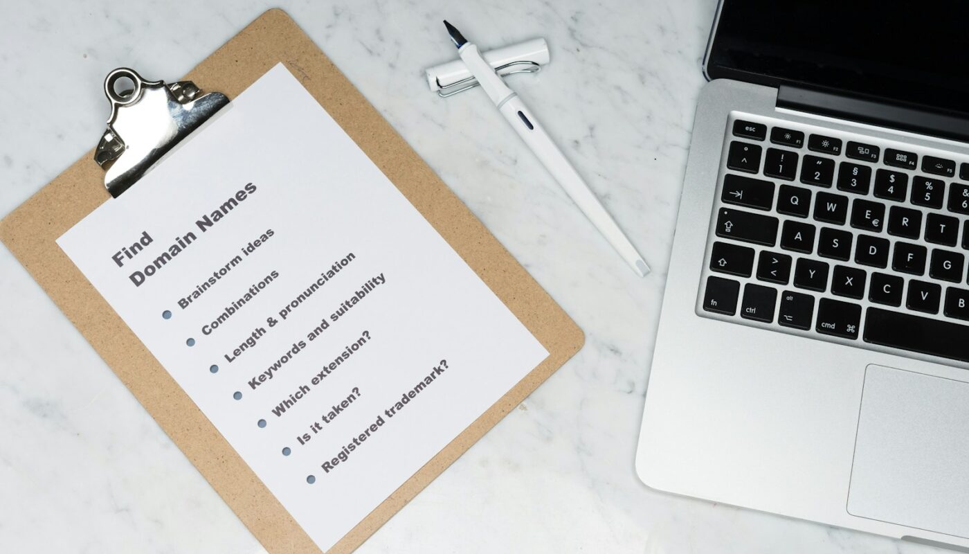 white printer paper beside silver macbook